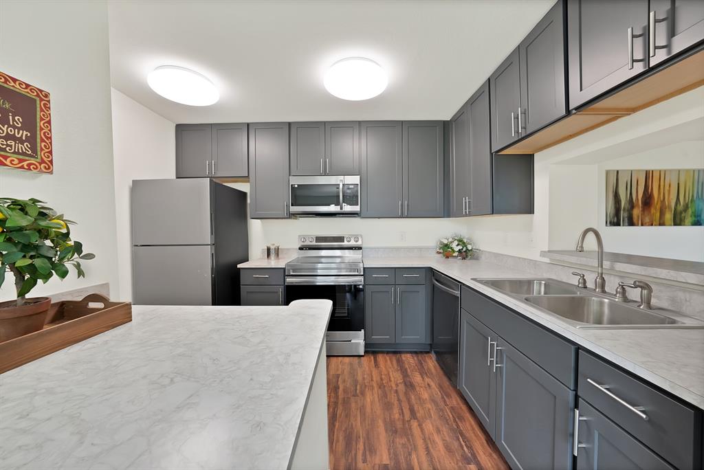 Completely rebuilt and move-in ready! This ground-floor condo was reconstructed after a previous building fire and now offers the peace of mind of nearly everything being newly installed, including the washer, dryer, and refrigerator. Enjoy durable luxury vinyl plank flooring throughout, a rare oversized walk-in closet, and the largest floor plan in the community.
Thoughtful owner upgrades were made to support comfortable aging in place, adding convenience and accessibility for years to come. The kitchen and bathroom feature all-new cabinetry, and both the front entry door and sliding patio door include screen doors for added comfort and airflow.
Conveniently located near the community mailbox, trash receptacle, and an alternate community exit, this home combines accessibility, functionality, and modern updates in one exceptional package.