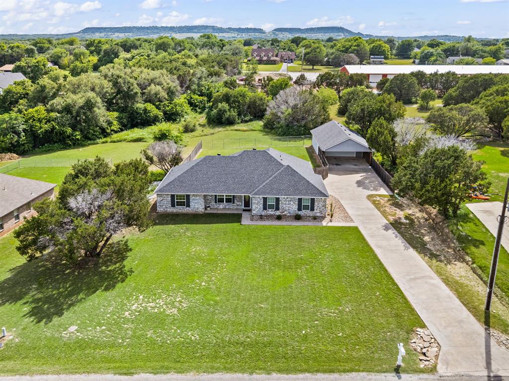Located in the gated Indian Harbor subdivision, this 4 bedroom, 2 bathroom home offers a rare balance of privacy and community on a full 1 acre lot. The interior has been refreshed for a clean, move-in-ready feel. The four bedroom plus bonus room layout provides plenty of space, while the oversized detached 2 car garage offers significant room for a workshop, storage, or larger vehicles. The backyard serves as a private getaway with an in ground pool, providing a quiet space to cool off. Because the property sits on a full acre, you have the benefit of a spacious, open feel that is hard to find in many gated neighborhoods. It is a perfect setup for those who want their own land without sacrificing the security and social benefits of an established community. As part of the Indian Harbor HOA, residents enjoy a wide array of amenities that cater to an active lifestyle. You’ll have access to the community clubhouse, pool, teen center, and walking trails. For lake lovers, the neighborhood includes a private marina with a boat ramp and fishing pier, plus the convenience of the on-site Marina Café. This property is a great opportunity for anyone looking for a functional, updated home with plenty of outdoor space and lake access perks.