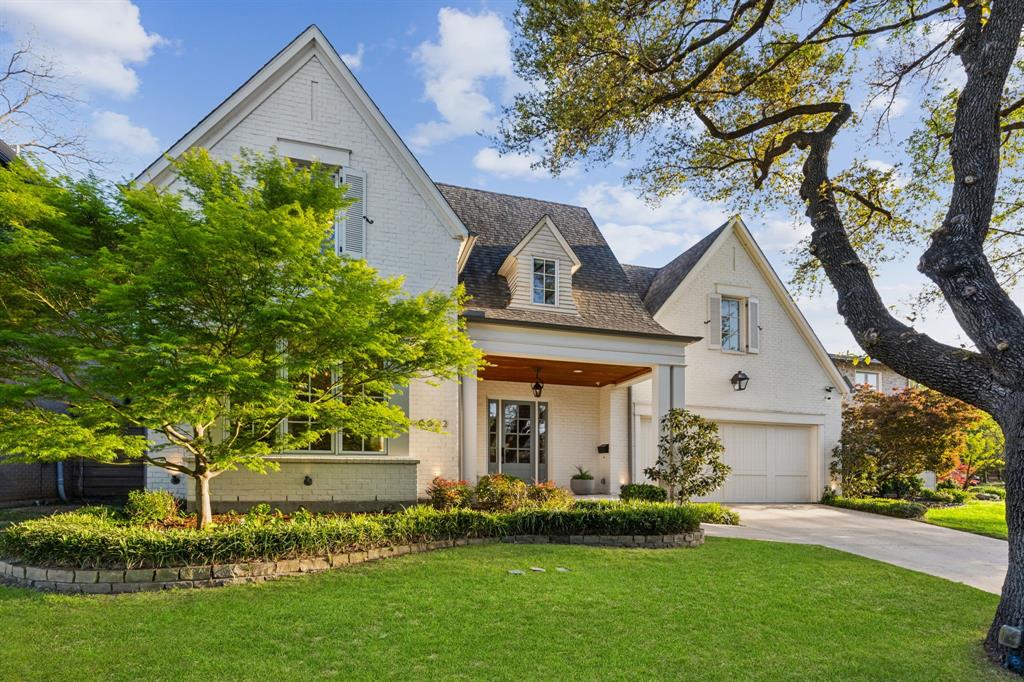 Welcome to 6622 Blue Valley Lane... one of the most charming and timeless homes ever to be offered in Dallas' coveted Lakewood neighborhood. Tucked away on a hidden gem of a street and perched up on an elevated lot, this home captivates from the moment you arrive. Custom finished by the current owners when new, you'll find a level of detail and quality here that is not typically found in more common builder spec properties. Spaces include 5 bedrooms with a downstairs guest suite, 5 en-suite baths, powder bath, mud room, wet bar, large utility room, attached 2-car garage, and 4 living areas in a thoughtful open layout.  Upscale amenities include hardwood flooring, gas fireplace, Thermador stainless appliances, ceiling beams, built-in sound speakers, upgraded lighting and plumbing fixtures, stone countertops, and custom draperies.  The striking primary suite offers a vaulted ceiling and a luxury hotel-style bath with a soaking tub, separate shower, double sinks, generous walk-in closet, and high-end finishes throughout. Vacation at home in the stunning resort-style backyard with a swimming pool, fountains, covered dining pavilion with an outdoor kitchen, professional landscaping, and a spacious covered patio complete with a fireplace and motorized screens. This special property is zoned to Lakewood Elementary School and is just minutes from White Rock Lake, Lakewood Village, neighborhood parks, and only a short stroll or bike ride to a number of popular shops and restaurants at Abrams & Mockingbird Lane.