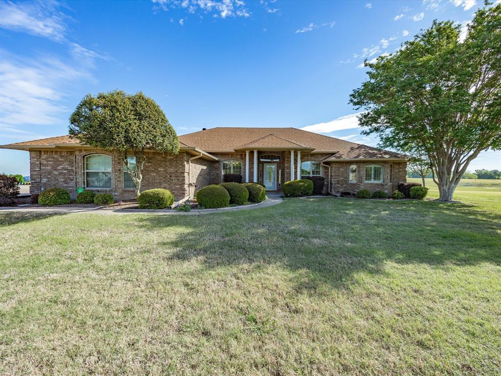 **Price improvement due to change in acreage** Discover the perfect blend of peaceful country living and everyday convenience on this beautiful 4-acre property in Ennis ISD. This spacious 4-bedroom, 2-bath well maintained home offers room to spread out with two comfortable living areas, ideal for entertaining or relaxing with family. The oversized primary suite is a true retreat, featuring dual closets, separate vanities, and a large jetted tub for unwinding at the end of the day. One secondary bedroom includes built-in cabinetry and a desk—perfect for a home office, study space, or hobby room. The home features a cozy Heatilator fireplace, adding warmth and charm to the main living space. A 2-car attached garage provides convenience, while the detached 1-car garage with an attached carport—designed to match the home—offers additional storage and parking flexibility. Step out onto the oversized covered patio and enjoy wide-open Texas skies, a scenic pond, and growing pecan trees that provide the ag exemption. The property is fully fenced with an electric gate, providing both privacy and security. This property has it all. Schedule your showing today.

Experience the best of both worlds—quiet country living with the convenience of a short drive to nearby cities for shopping, dining, and commuting.