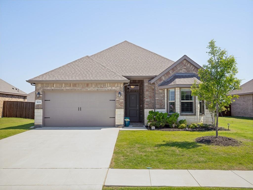 Welcome to this beautifully designed 4-bedroom, 2-bath home with a 2-car garage, perfectly situated on an oversized lot in the heart of Krum, Texas. From the moment you arrive, you’ll appreciate the charming covered front porch with brick flooring, full brick exterior with stone accents, and inviting curb appeal. Inside, the open-concept layout offers the perfect blend of style and functionality with wood-look ceramic tile flowing throughout the main living areas and soft carpet in the bedrooms. The spacious living, dining, and kitchen areas create an ideal space for entertaining and everyday living. The gourmet kitchen is truly a chef’s dream, featuring a large island, quartz countertops, custom-painted cabinetry, and a designer herringbone tile backsplash. Thoughtful details continue throughout the home with a mudroom off the garage entry, utility room with built-in shelving, and elegant plantation shutters throughout. The private primary suite is tucked away for added privacy and features double doors leading to a spa-like ensuite bath complete with a spacious walk-in shower and oversized walk-in closet. The additional three bedrooms are generously sized and perfect for family, guests, or a home office setup. Step outside to enjoy the covered back patio overlooking the large backyard, offering plenty of space for gatherings, pets, or relaxing evenings outdoors. This home also includes modern smart-home features with remote access to the front door, garage, porch light, and thermostat, along with room for future upgrades. Plus, the builder’s warranty still has 7 years remaining for added peace of mind. Located just minutes from Denton and I-35, Krum offers the perfect balance of small-town charm and convenience with quick access to UNT, TWU, shopping, dining, entertainment, and major employers while maintaining the welcoming atmosphere North Texas residents love.