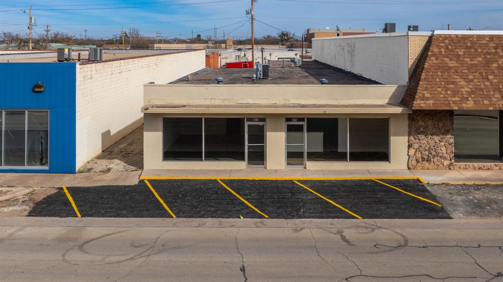 Positioned in a prime downtown location directly across from the Abilene Convention Center, this commercial property offers exceptional visibility and opportunity. With strong street frontage and newly painted parking spaces, your business will benefit from exposure and convenience in the heart of Abilene. The building is thoughtfully divided into two functional sides, offering flexibility for multiple businesses or one expanding operation. One side features a large showroom with picture windows that flood the space with natural light, a private office, a second spacious showroom, and a warehouse with a restroom. The second side includes two generous showroom spaces with new carpet, two office spaces, a kitchenette, a restroom, and a large warehouse area ideal for storage, distribution, or workspace needs. Whether you are looking to retail, expand, lease out space, or create a multi use business hub, the potential here is truly endless. Opportunities like this in the heart of downtown do not come along often.