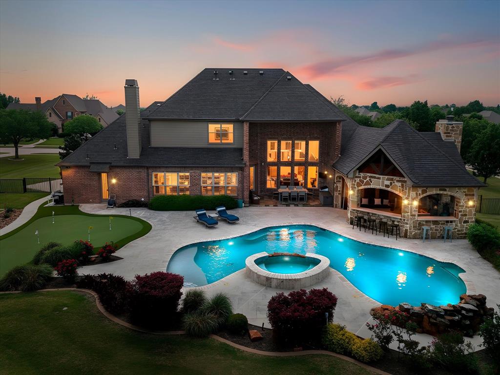 Nestled on nearly an acre beneath mature trees in Heath’s highly sought-after Stoneleigh neighborhood, this exceptional estate blends luxury living with practical value. The backyard is a true private retreat, featuring a resort-style pool and an expansive outdoor living space complete with a fireplace, built-in gas grill, Big Green Egg, dual refrigerators, and a covered outdoor living area with TV and furnishings that will remain with the home. All outdoor patio and poolside furniture will also convey, allowing the next owner to immediately enjoy the space.

Inside, the thoughtfully designed floor plan is filled with natural light and offers spacious living areas, a well-appointed kitchen with excellent flow, a private primary suite, and versatile secondary bedrooms. The primary bedroom TV, exercise room TV, and an impressive media room complete with projector, furniture, and audio equipment will remain with the property. Certain additional furniture pieces and appliances may also be available.

The seller is willing to consider concessions toward a mortgage rate buy-down or buyer closing costs, creating an opportunity to reduce upfront expenses and monthly payments. The pool heater was replaced in Spring 2026, and the home is equipped with an upgraded Class 4 impact-resistant roof installed in 2021, which may qualify the future owner for insurance premium discounts (buyer to verify with their insurance carrier).

Conveniently located near Lake Ray Hubbard, shopping, dining, and top-rated Rockwall ISD schools, this property offers the space, amenities, and lifestyle that make Heath one of North Texas’ most desirable communities. With extensive included amenities, recent updates, and potential monthly savings opportunities, this is a rare offering in Stoneleigh.