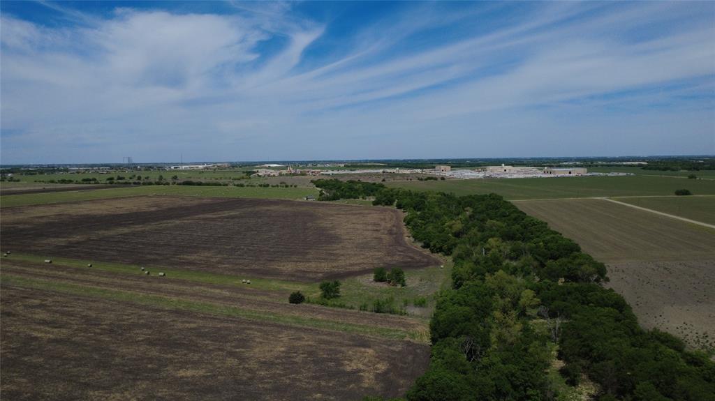 Wooded & Clear land outside city limits, ready for your dream home, barn, and livestock. Right off Hwy 67 and easy access to
I35, shops and stores. Close enough to the city with no city taxes. Agricultural exempt, potential to be carried if
requirements are satisfied. Verify utilities with appropriate entities. Partial wooded area is in flood zone, the rest is clear.
Septic system needed, water available at the road.