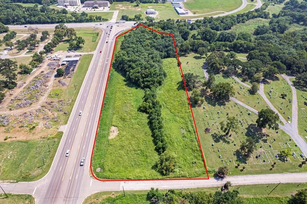 Situated in a prime location within the vibrant City of Bonham, Texas, this property is located at the intersection of Highway 121 and Highway 56 (W. Sam Rayburn Drive), extending all the way to W. 7th Street. This intersection ranks among the busiest in the county and is strategically positioned in a critical growth area.  The majority of the growth is occurring along this corridor with major franchises popping up everywhere.  If excellent exposure and easy access is what you are looking for, this property is it.  Road frontage on three sides, (Hwy. 121, Hwy. 56 and W 7th Street) allows for many potential uses and opportunities.  Bonham is conveniently located approximately 33 miles from Paris, 27 miles to Sherman, 10 miles to the Texas-Oklahoma Stateline, and an hour from the Dallas-Ft. Worth Metroplex.