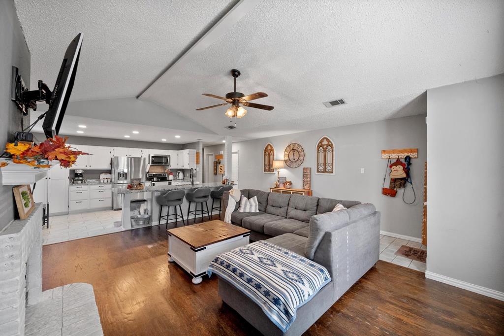 This wonderful home has so many wonderful features! Open living concept with updated kitchen & new cabinetry, roomy closets in the secondary bedrooms, and a well appointed backyard with a large storage shed.  The side deck is perfect for enjoying wonderful fall & spring evenings with family and friends.  The primary bathroom has been updated with a large walk in shower. No carpet!  Hardwood & Tile floors throughout.  Roof, hot water heater and HVAC system are only 3 years old.  Large storage shed in the backyard conveys with the property.   You won't want to miss this adorable home that is located in the highly rated Mansfield ISD.