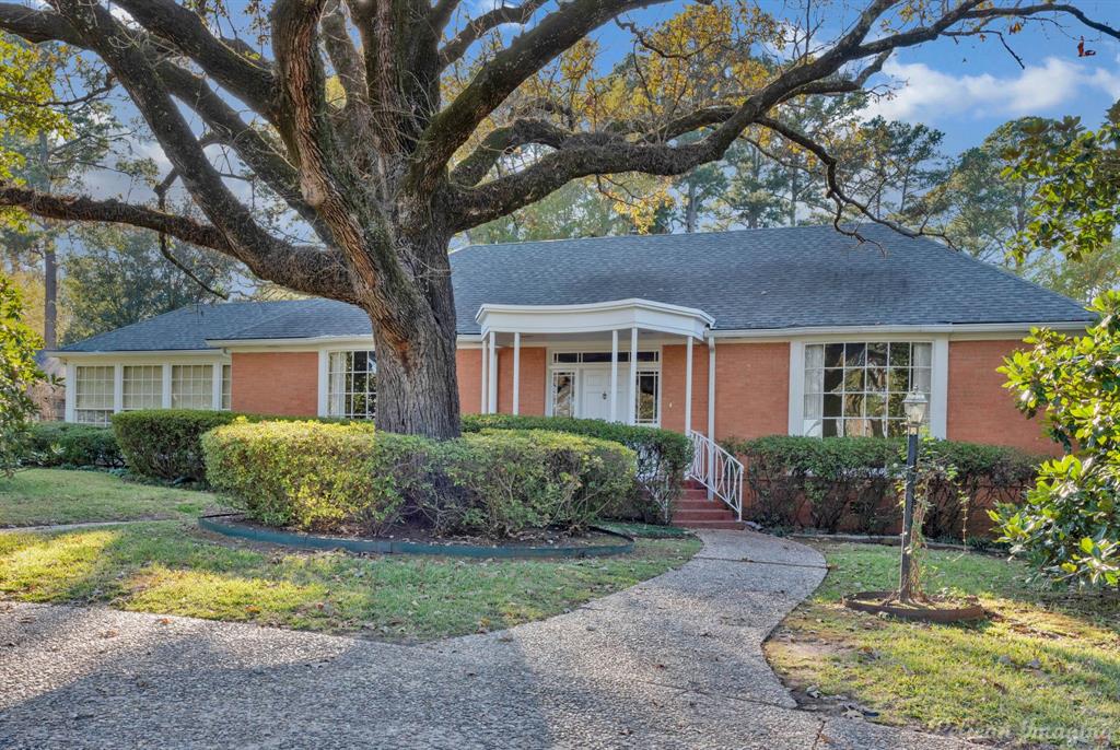 Incredibly located in the heart of Pierremont on East Ridge Drive, this classic and traditional
home features a circular drive anchored by a beautiful oak tree.  The charming entry opens
to the formal living room with beautiful wood floors, decorative fireplace with pretty mantel
and marble surround, with french door to lovely garden room. Gracious dining room with bay window and pretty hardwood floors. Cozy den with knotty pine paneled walls and woodburning fireplace with gas starter and built ins, wood flooring.  Bright and cheery kitchen is spacious.  Each bedroom has
full bath.  Downstairs has storage room and shop.  3 carport spaces.  Beautiful corner lot.  You
will love this home!