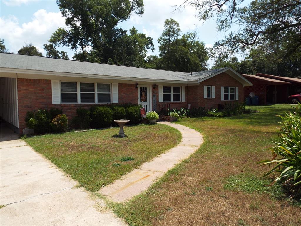 This spacious 3 bedroom, 2 bathroom home has everything you need to settle in and make it your own! Featuring both a living room and cozy family room with fireplace, plus a dining area and functional kitchen, there's plenty of room for relaxing and entertaining. Brick home, large fenced backyard, huge storage building, located in an older quiet neighborhood, and walking distance to the golf course and downtown. Whether you are looking for the perfect starter home, downsizing for retirement, or wanting a peaceful place to call home, this is one for you.