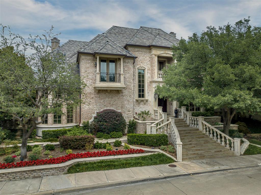 Incredibly unique property offering a carefree lock and leave lifestyle in the gated Lake Forest community.  Custom built by Bob Thompson, this luxury home has a floor plan which appeals to singles, couples or families. The main house offers several living areas, first floor primary suite with dual baths and custom closets, 2 additional generously sized bedrooms with en-suite baths, high ceilings, open floor plan, elevator and attached 3-car garage. A charming stone path with wisteria covered archways leads to the guest house which has multiple living spaces including two bedrooms or offices, a library, full bath, kitchen area and attached garage. It functions beautifully as a place for family and friends to stay or for use as a home office or studio. The lovely pool is accented by a garden and large grassy area. Originally 2 lots, the property has been re-platted as one lot, encompassing approximately half acre.