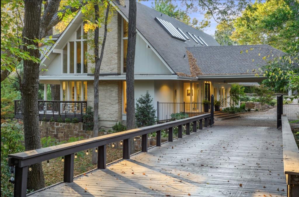 A Contemporary Gem in the Prestigious North Dallas-Private School Corridor Set on just over one acre, 11545 Hillcrest Road offers a striking blend of modern luxury and museum-quality design. Enter through a private gate to this home tucked far away from Hillcrest road where a lighted wooden bridge leads to the porte-cochère, creating a dramatic sense of arrival and setting the tone for this fully updated contemporary estate.Inside, cathedral ceilings, expansive glass, and gallery-style walls introduce exceptional natural light and an elevated architectural presence. This home was completely remodeled adding 300 sf to the living room, chef inspired kitchen, addition of a full bar with 3 wine refrigerators, perfect for cozy gatherings  or family fun! The home is cleverly appointed with 3 living areas, screened in outdoor living space with a full kitchen, and a bonus sun or sitting room perfect for morning coffee or cozy spot to watch the sun set  and with 5 fireplaces each adding warmth and sophistication to the beautifully scaled living and entertaining spaces. Currently this home features 3 bedrooms (with space to convert the 3rd living space upstairs into a 4th bedroom), 3 full and 1 half remodeled bathrooms, this home was meticulously crafted for versatility, and was designed to host large Exclusive events or small intimate gatherings with seamless flow between indoor and outdoor living. Multiple living areas, grand dining spaces, and a chef’s kitchen complement resort-inspired outdoor venues framed by mature trees and curated lighting. A rare offering in the elite North Dallas private-school corridor, this estate delivers unmatched style, acreage, and amenities—an iconic contemporary retreat in one of the city’s most desirable settings.