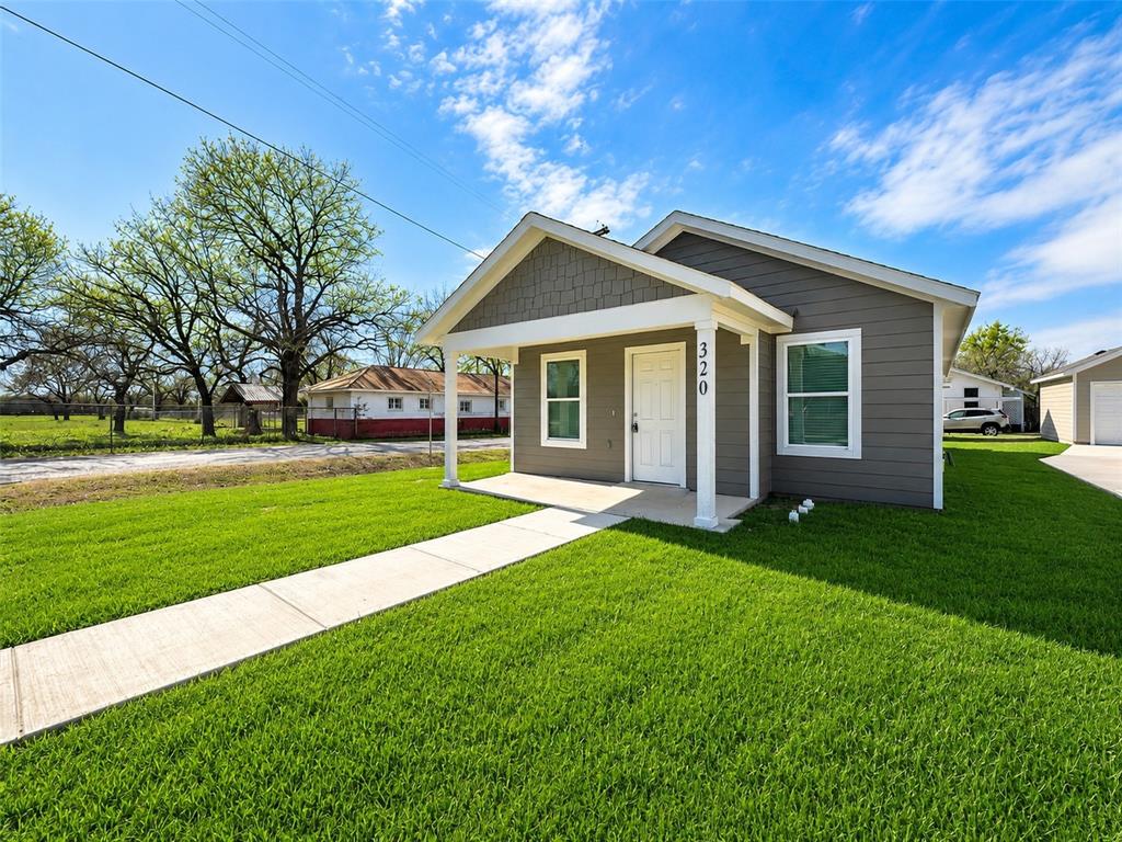 Welcome to 320 SW 14th St. in the heart of Mineral Wells! Situated on a desirable corner lot, this charming newly built home offers modern comfort, thoughtful design, and incredible value. The property features its own private driveway leading to a detached garage in the back, providing added convenience, privacy, and extra parking space. Step inside to an open-concept layout featuring spacious living and dining areas, beautiful flooring, and abundant natural light throughout. The kitchen offers stylish cabinetry, ample counter space, and a functional layout perfect for everyday living and entertaining. The home features generously sized bedrooms, well-appointed bathrooms, and a warm inviting atmosphere throughout. Outside, enjoy a large yard with plenty of room for outdoor gatherings, pets, or future landscaping possibilities. Conveniently located near schools, shopping, dining, and all that Mineral Wells has to offer, this property is perfect for first-time homebuyers or anyone looking for a low-maintenance in a new home.
Don’t miss your opportunity to own this beautiful corner-lot property with detached garage access at an incredible value!