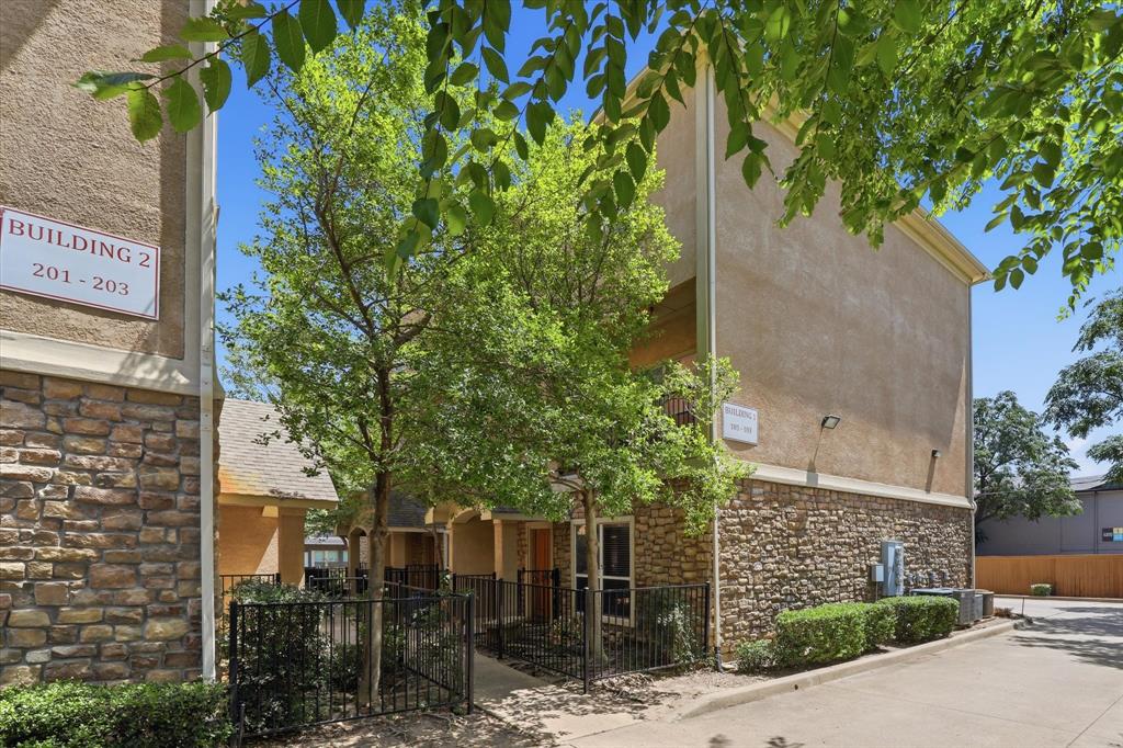 Experience the ease of low-maintenance living in this beautifully updated three-story condo, ideally located in the heart of Dallas just minutes from Dallas Love Field and the Dallas North Tollway. Whether you're a busy professional, frequent traveler, or simply looking to spend less time on home maintenance and more time enjoying the city, this stylish residence offers the perfect lock-and-leave lifestyle. Step inside to a versatile first-floor flex space that can easily serve as a home office, secondary living area, fitness room, or guest bedroom. Rich hardwood floors lead to the second level, where an open-concept design creates the ideal setting for everyday living and effortless entertaining. The spacious living room opens to a private balcony, offering the perfect spot to enjoy your morning coffee or unwind at the end of the day. The well-appointed kitchen is designed to impress, featuring granite counter-tops, stainless steel appliances, and two pantries that provide exceptional storage. The adjoining dining and living areas offer seamless sightlines, making it easy to stay connected while hosting family and friends. Head to the third-floor where you'll find the primary bedroom complete with a spa-inspired ensuite bath showcasing dual sinks with granite counter-tops, a relaxing garden tub, separate shower, and a generous walk-in closet. A secondary bedroom also enjoys the privacy of its own ensuite bath and walk-in closet, making it ideal for guests or roommates. Perfectly positioned near Turtle Creek, Oak Lawn, the Medical District, and Love Field, you'll enjoy quick access to premier shopping, acclaimed restaurants, vibrant nightlife, and major employment centers. This exceptional condo offers the ideal blend of comfort, convenience, and the carefree lifestyle that makes condo living so desirable.