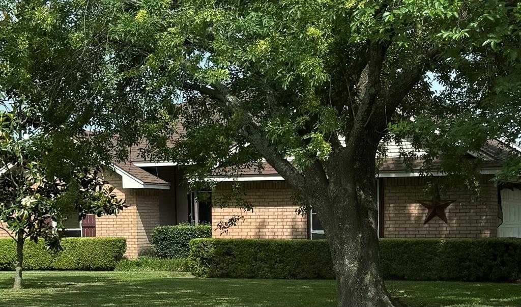 Welcome to this beautiful brick home featuring a large partially fenced 1.028-acre lot, offering a balance of curb appeal and utility. 20 Misc. fruit trees blueberry bushes and 6 raised beds for gardening 2 grapevines and an asparagus bed. Backyard also features a fully functional Greenhouse. A 24x24 storage building equipped with electricity, Includes a separate office space with dedicated AC and
. Features roll-up doors on both sides for drive-through access or ventilation and also
Contains stairs leading to a partially floored storage area, maximizing vertical space.
 A 16x20 workshop that is also total electric, suitable for heavy-duty projects or specialized equipment.
Home features a beautiful wood burning fireplace and comes with kitchen appliances. Comes with a gas generator that is programed to run 10 minutes a week to keep itself ready for any emergency power you may need also has 9 solar panels that go straight to the house and has a shut off at the house as well.
Fully covered back patio is perfect for get together and relaxing evenings.