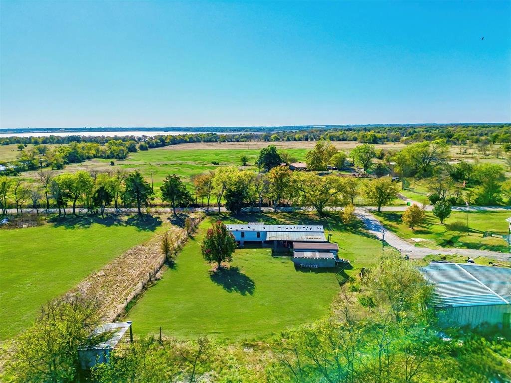 Discover the perfect blend of space, affordability, and recreation with this unique property.  Just minutes from Cooper Lake, this mobile home sits on a spacious 1 acre lot with a front porch, back patio, and carport, offering endless potential.  Information deemed reliable but not guaranteed.  Buyer and buyer's agent to do own due diligence.