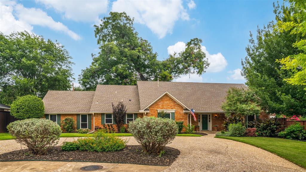 Classic traditional with 3609 square feet (DCAD) of well maintained living space set on a .33 lot. Charming drive up with circular drive and lovely landscaping. The entry is bright and open with rustic brick pavers open to the spacious living room where windows flank the fireplace adding lots of natural light and views of the patio with a full wall of built-ins for storage and display. The kitchen is well equipped with double ovens and a smooth cooktop and cosmetic updates to appliances and surfaces can turn this into a chef's dream kitchen. The breakfast area has a lovely bay window overlooking the back yard. The family room is adjacent to the kitchen creating a perfect spot for a play room. The spacious primary suite is down and offers a large bath with dual sinks, jetted tub and stand alone shower. A full bath and large laundry room complete the first floor. Upstairs, there are three bedrooms, two share a Hollywood bath and the third has an ensuite bath. All the bedrooms have nice size closets. Outdoor spaces are beautifully landscaped and there is ample room for a pool with room left over for play area. The backyard shed has electricity and could easily be a workshop, studio or hobby area! Close to dining and terrific shopping including Trader Joes, this home has tons of potential and cosmetic updates will make it shine!