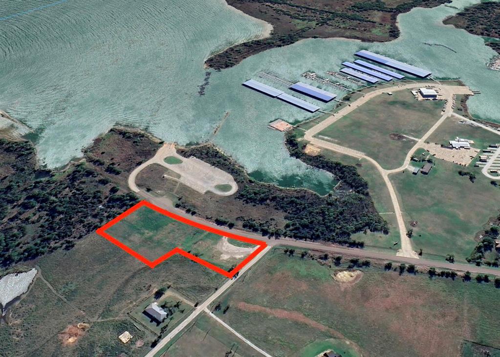 3.28 acre corner ready-to-build lot directly adjacent to Lake Ray Roberts and across the street from the boat launch and marina. The marina is under new management and is being expanded and rebuilt!  VIews of the lake and protected by Corps of Engineer property! Electrical on site. Buyer to verify all details