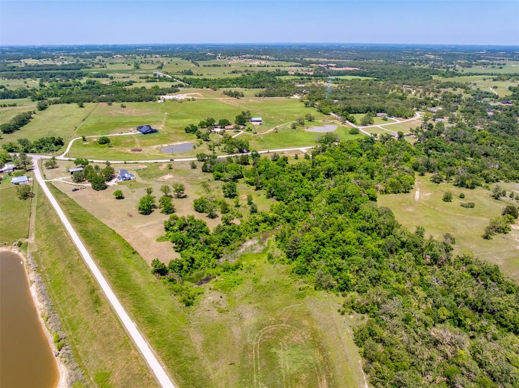 6.78 ACRES Beautifully landscaped land with oversized pond to surround your dream home...Seller has home plan and windows already purchased. No mobile homes are allowed. Septic is already installed and there is access to utilities for quick hookup to your newly built Barndominium or home. The area screams of owner pride and the sunsets are beyond the normal Texas sky. Please may your way out to this unique area in Springtown and meet your new neighbors. Use 1868 County Road 3672 to locate this land.