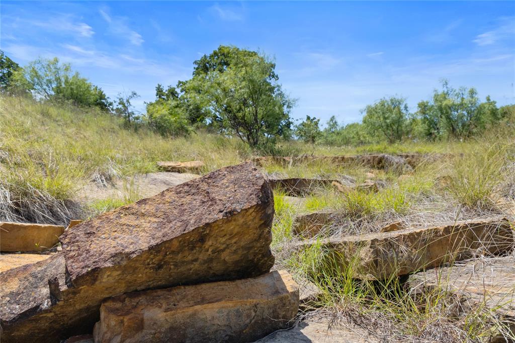 Gursky Ranch -331± Acres - Jack County, Texas
The Gursky Ranch is a rare opportunity to own 331± acres in the heart of the historic Cross Timbers region of Jack County, just south of Bryson, Texas. Established in 1994 and held by the same family for decades, this ranch offers a unique combination of history, natural beauty, recreational appeal, and agricultural potential.
Located near the site of a famous frontier battle and surrounded by an area rich in Texas history, the property presents an exceptional setting for a working cattle operation, hunting retreat, weekend getaway, or future country estate. With no active oil or gas wells on the property and no minerals available for conveyance, the ranch's value lies in its land, scenery, and versatility.
The ranch features a diverse landscape of mature hardwoods, including native live oaks and post oaks, creating excellent wildlife habitat and a picturesque setting. Numerous areas have been selectively cleared to enhance grazing opportunities and improve visibility throughout the property. Rolling terrain, deep ravines, and scattered gullies provide dramatic elevation changes, breathtaking views, and unique character rarely found on ranches this size.
Water resources are a strong asset, with four stock tanks currently in place and additional locations suitable for future water development. Water wells in the area are known to be productive, offering confidence for future improvements.
Whether you're seeking a productive cattle ranch, a recreational property with outstanding hunting potential, or a blank canvas to build your dream home overlooking the Texas countryside, Gursky Ranch offers unlimited possibilities. Properties with this combination of acreage, terrain, water features, and location are becoming increasingly difficult to find.
Come experience the beauty, privacy, and potential of Gursky Ranch, where Texas history, rugged landscapes, and opportunity come together.
SELLER WILL CONSIDER SUBDIVIDING.