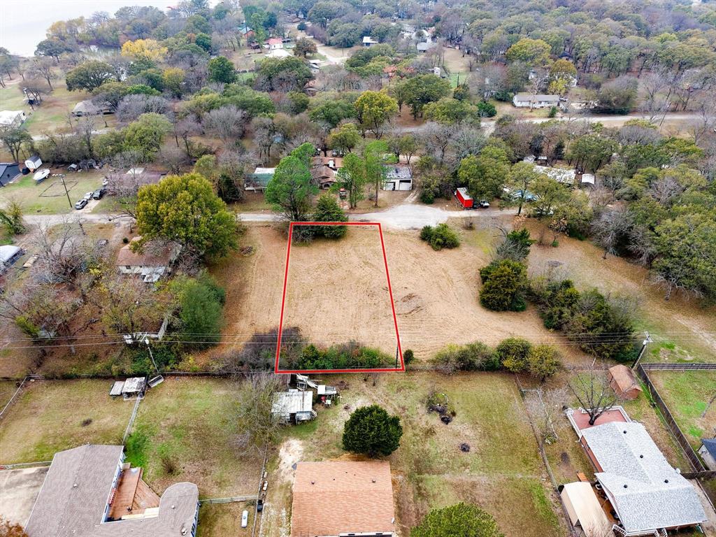 Nestled on a quiet cul-de-sac in the Whispering Oaks community on Lake Tawakoni, this lot offers an ideal setting for peaceful lake living. The property is within a quarter of a mile of the community park and boat ramp on Lake Tawakoni, making it ideal for easy access to fishing and boating or a quick walk to the park.  Located approximately 1 hour and 15 minutes east of Dallas, this area offers peaceful lake living with convenient access to the city. See MLS 21115933 for the opportunity to purchase all three lots, offering a combined total of 0.98 acres.