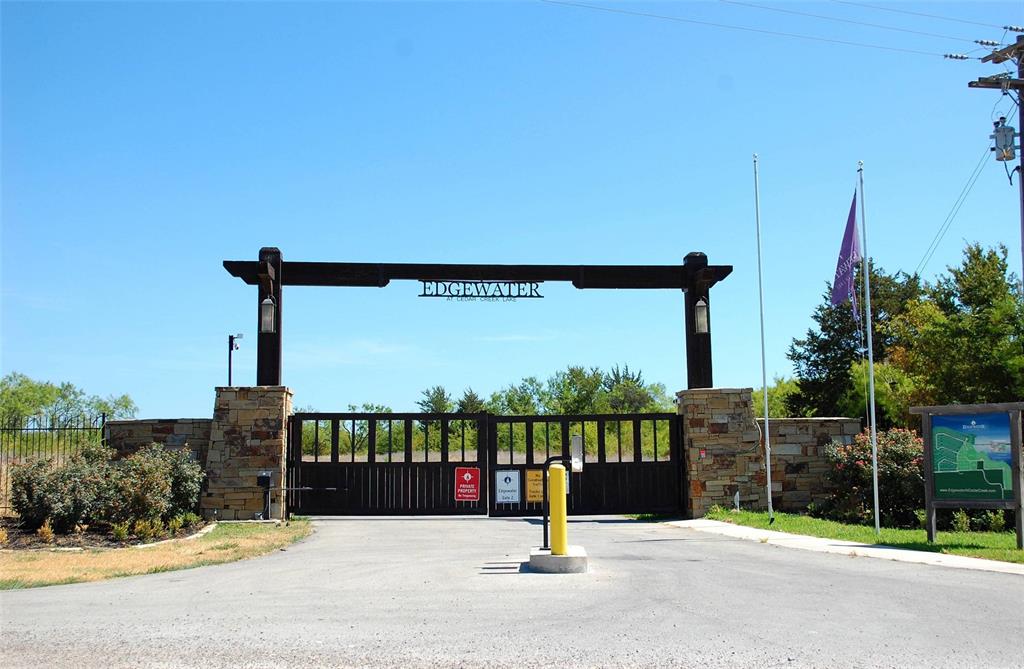 Edgewater is THE luxury destination at Cedar Creek Lake.  Just under an hour drive from downtown Dallas. Perfect for an exclusive estate home with incredible privacy! It's platted as 1 of 4 adjacent individual lots, so if you want a compound with multiple homes, that works too! Minimum square footage is 1,500 feet, but homes in the neighborhood go to over 4,000 square feet. It's outside city limits for lower taxes ($ 1.8022 per hundred), and no current MUD tax. Edgewater amenities include a community marina with boat docks, almost a mile of hiking trails, a secure community boat & RV storage lot, & more! The clubhouse is under construction and will include a workout room, and a playground. A community pool is also in the planning stages. Your HOA dues include a Careflite membership, so medical care is just a short flight away. Underground utilities include co-op electric and MUD water, septic system will be necessary. The new communications tower is now complete for stronger cellular and internet signals. Seller financing is available with minimum 20% down, 30 year amortization with a 2 or 3 year balloon, rate to be determined based on LTV and creditworthiness. Seller will entertain breaking the property up, lots 1 and 2 ($ 225,000), lots 3 and 4 ($ 225,000), or lot 2 or 3 by itself ($ 120,000). Owners of multiple lots pay one HOA fee for up to 3 lots. Call listing agent for gate code.