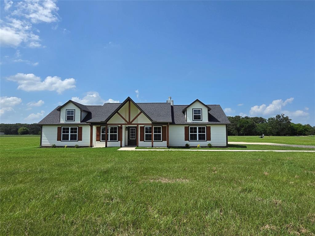 New Construction in Sandlin Ranch! Nestled in a quiet cul-de-sac within this gated lake community, this beautiful 4-bedroom,2.5-bath home with a dedicated office offers the perfect blend of comfort, style, and outdoor living. Situated on 1.74 acres with water views of Jake's Creek Cove on Lake Bob Sandlin, you'll enjoy peaceful surroundings and plenty of room to spread out. The thoughtfully designed floor plan with its quality craftsmanship and stylish finishes, features spacious living areas, an open-concept kitchen with granite countertops and Frigidaire appliances, a formal dining space, and a private office ideal for working from home or managing daily tasks. Large windows bring in natural light showcasing the peaceful surroundings. Step outside and imagine the possibilities. The oversized lot provides ample space for a shop, pool, outdoor entertainment area, or additional storage for your lake toys. Residents of Sandlin Ranch enjoy a stocked neighborhood pond, and abundant wildlife, with deer being a daily sight throughout the community. Whether you're looking for a full-time residence or a weekend retreat, this new construction home offers the best of East Texas lake living with modern conveniences, privacy, and room to grow. Don't miss your chance to own a brand-new home with water views, acreage, and access to one of East Texas’ most desirable fishing lakes. Did I mention that it’s less than 15 minutes from a public boat ramp? Schedule your private tour today! **Some photos are digitally enhanced or virtually staged.**