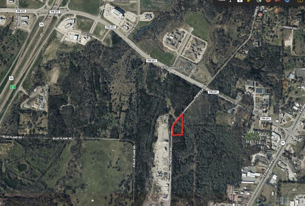 Located between 1-75 and Texoma Pkwy, this property is just under two acres and zoned commercial. Great investment opportunity or use for commercial business.