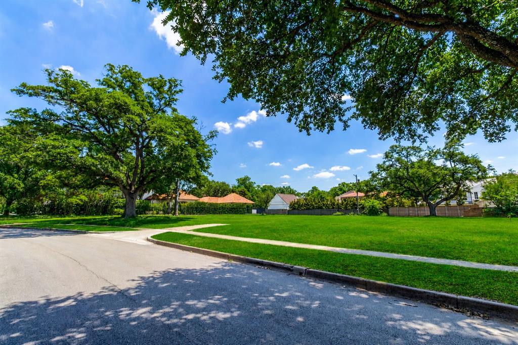 Situated on a rare 170-foot-wide lot, this is a truly exceptional and unique opportunity. Spanning 0.677 acres, this beautifully treed property—featuring several mature trees—has been graded and is ready for the construction of your dream home. Ideally located on one of Highland Park’s most desirable streets, it is within walking distance to Highland Park Village, Bradfield Elementary, as well as nearby parks, shops, and dining. The lot measures approximately 29,470 square feet (see new survey attached).