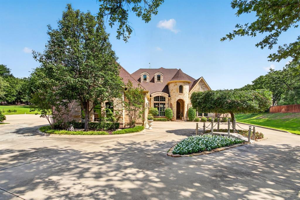 **OPEN HOUSE CANCELED FOR SUNDAY JUNE 21** Welcome to luxury living in the prestigious Estancia community of Fort Worth. Nestled on a beautifully landscaped 1.25-acre homesite surrounded by mature trees, this exceptional custom home offers the perfect blend of elegance, comfort, and functionality. From the moment you step inside, you'll appreciate the rich hardwood flooring, soaring ceilings, and highend finishes that define every space. The thoughtfully designed floor plan features two private primary suites on the main level, each offering spa-inspired bathrooms with deep soaking tubs, separate showers, and generous walk-in closets. One suite boasts an enormous custom-designed closet that is sure to impress.Designed for both everyday living and entertaining, the formal dining room showcases a stunning wood planked barrel ceiling that adds warmth, character, and architectural distinction. The chef's kitchen is a true centerpiece, featuring extensive custom cabinetry, abundant counter space, a large island with prep sink, double ovens, built-in microwave, 5-burner gas cooktop, and an oversized walk-in pantry. Upstairs, you'll find an entertainer's dream complete with a spacious game room and full wet bar featuring a sink, dishwasher, and under-counter refrigerator. A private guest suite with its own full bath provides
comfortable accommodations for family and visitors, while the dedicated media room creates the perfect setting for movie nights and game-day gatherings. Outside, the expansive 1.25-acre lot offers exceptional plenty of room to create your dream backyard oasis, including space for a custom pool, outdoor living area, and more. This remarkable Estancia property combines luxury finishes, versatile living spaces, and an unbeatable setting to create a home that is truly one of a kind. Come experience luxury living just outside the city limits of Fort Worth with lower tax rates, but only 20 minutes to downtown Fort Worth.