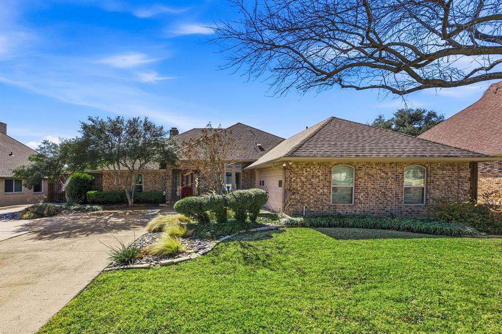 Experience golf course living on Brookhaven’s Championship Course with sweeping views of the 13th fairway. Thoughtfully updated throughout, this home blends functionality, flexibility, and elevated indoor-outdoor living in one of Farmers Branch’s most established golf course communities.

The updated kitchen serves as the heart of the home, featuring professional-grade appliances, generous prep space, and seamless flow into the main living and dining areas. A separate wet bar adds to the home’s natural entertaining layout, while expansive windows frame peaceful fairway views from multiple rooms.

The flexible floor plan offers two spacious living areas, including a more private rear den positioned near the sunroom—ideal for a media room, home office, or quiet retreat. The sunroom creates an effortless connection to the outdoors and includes private access from the primary suite.

A secluded secondary suite tucked just off the kitchen is separated by a sliding barn door and features a wheelchair-accessible roll-in shower, providing exceptional versatility for guests, multigenerational living, or live-in support.

Designed for both everyday enjoyment and entertaining, the backyard showcases a custom outdoor kitchen, covered seating areas, pool and spa, cart barn, and an electric gate with direct golf course access.

Ideally located within the Brookhaven Country Club community with convenient access to shopping, dining, and major commuter routes, this property offers a rare combination of golf course views, functional living, and timeless appeal.