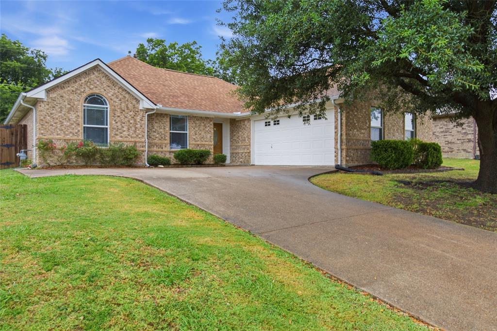 Welcome to an exceptionally maintained home tucked away in Ennis, known for its fields of bluebonnet trails and affectionately called the Bluebonnet Capital of Texas. Nestled in a growing neighborhood, this home features fantastic curb appeal, bright and airy natural light, and an oversized backyard. Upon driving up, you are greeted with blooming rose bushes, a J-Swing driveway, and a windowed garage, complete with organization racks and peg-board wall. The primary suite features views of the backyard and a oversized primary bathroom with a newly updated glassed-in shower and a walk-in closet with ample storage. Split bedrooms allow for some privacy while still providing abundant light, the ease of storage with wide closets, and the second bathroom just off the bedrooms and living room making it functional and convenient. The living room is accentuated by bright, cheery views of the backyard and anchored by a gas fireplace. The open concept kitchen and dining area invite you to mornings filled with east facing light, helping you get your day started. With room for more than one chef in the kitchen, tall cabinetry, and a stacked countertop, this kitchen makes meal prep a breeze, while keeping the mess out of sight. Abundant organization opportunities abound with hooks at the entryway, an oversized utility room, complete with drying rack space and storage area, as well as a hidden linen closet in the second bathroom. Step out into the sweeping covered patio and take in the expansive backyard and a second paved patio tucked around the corner that invites you to enjoy a peaceful respite while taking in the enjoyment of the vast greenspace. Structural updates include a new roof from 2022, HVAC and water heater from 2021 and previous foundation work from 2022 which added steel pressed piers, complete with a lifetime, transferable warranty. No Carpet throughout the home, making it easy to clean and allergy friendly. Welcome Home!