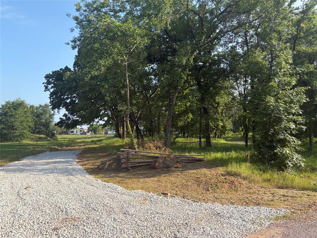 Build your dream home on this gorgeous 1+ acre corner lot in the coveted Oak Creek subdivision!  Located less than mile from Cedar Mills Marina and Pelicans Waterfront Restaurant. This property offers the perfect blend of peaceful country living and Lake Texoma convenience. 

Situated at the entrance of a quiet cul-de-sac, this beautiful property features mature trees, scenic views, and plenty of space to build your custom dream home, vacation retreat, or weekend getaway. Enjoy the freedom of no HOA while benefiting from deed restrictions that help preserve the neighborhood’s appeal and value. 

Property Features
 • 1 + acre corner lot
 • Coveted Oak Creek subdivision
 • Entrance located on a cul-de-sac
 • Less than 1 mile from Cedar Mills Marina
 • Near Pelican’s Landing Waterfront Restaurant
 • No HOA
 • Deed restrictions in place
 • Mature trees and beautiful views
 • Excellent Lake Texoma location