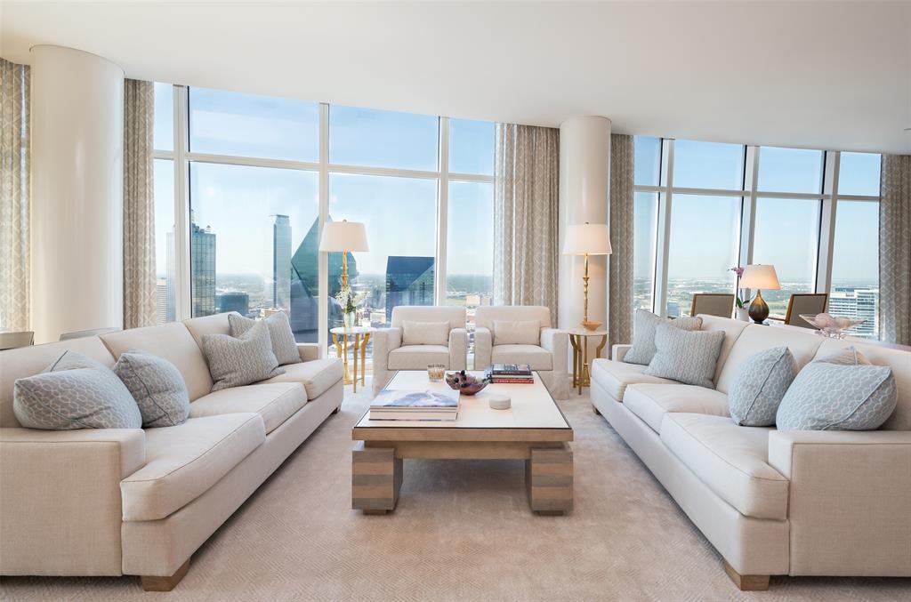 The height of luxury at Museum Tower, this half-floor residence was designed by Alex Eskenasy and Josie McCarthy and built to perfection by Jonathan Sebastian. White high gloss acrylic walls and 5’’ oak floors add warmth while leading you through a space illuminated by Craig Roberts custom lighting. The Chef’s kitchen features oak Bulthaup cabinetry, complemented by Wolf appliances-2 convection ovens,1 steam oven, and a 48'' gas range. A Subzero refrigerator and a full-height wine closet complete this culinary haven. The primary bedroom boasts breathtaking views of Downtown Dallas, and is equipped with remote-controlled blackout shades for privacy. The primary bath is a sanctuary of indulgence, with a soaking tub, walk-in shower with custom mosaic tile flooring, Lefroy Brooks hardware, double sinks and a separate built-in vanity. This residence has three prime parking spaces, just across from the elevator lobby,+spacious storage unit. Schedule your tour and experience luxury redefined.