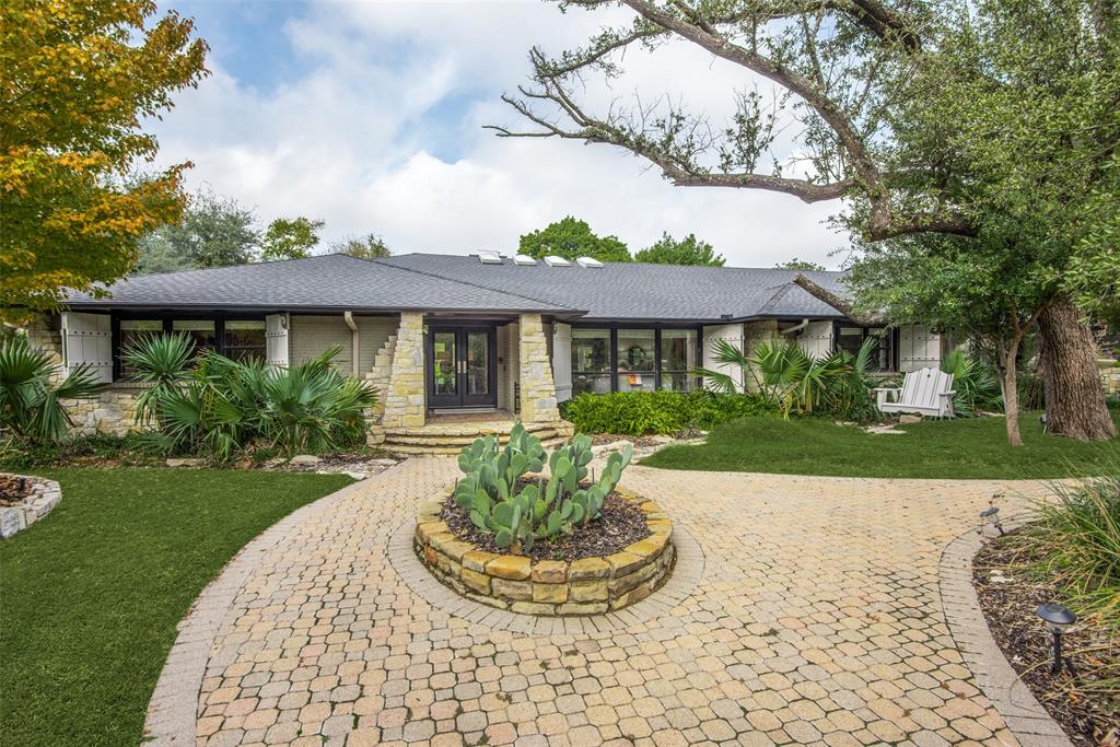 Stunning one story home on a lusciously landscaped very large lot. It’s unique in shape in the incredible landscaping and tree sets the stage for the utmost privacy. This pier and beam home is tucked away on a private cul-de-sac. There is a wonderful large master suite with fireplace and separate exercise facility with refrigerator and  coffee bar overlooking the backyard. There are three other en-suites with baths.  The spacious ranch style home had an amazing renovation adding a very large game room, bar and upstairs studio or guest quarters. You will find 2 built in sub zero refrigerators, 2 built in ice makers and 2 dishwashers along with many other professional appliances. There is so much workable living space at 6813 sqft. .There is a resort style pool and cabana with built-in grill and fireplace for entertaining. You’ll find a walking path that lines the outdoor grounds with gas lanterns. This is a chance of a lifetime to own this amazing property!