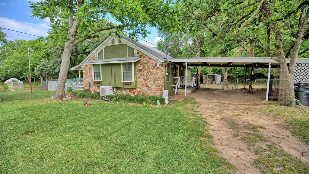 THIS IS A MUST-SEE PROPERTY! This cute 3-bedroom, 2-bath cottage-style home is the perfect place to enjoy life at Lake Nocona. Whether you love fishing, water sports, or simply relaxing and taking in the peaceful surroundings, this property is ready for you to enjoy.

Situated on spacious lots in Nocona Lake Estates, the home is surrounded by gorgeous mature shade trees and offers beautiful lake views, creating an inviting setting to relax and unwind. The fenced yard provides a great space for pets, children, or simply enjoying the outdoors and natural beauty of the property.

Recent updates and improvements make this home move-in ready, including completed foundation repairs, mini-split systems installed for efficient comfort, and new subflooring and flooring throughout. The updated kitchen features new cabinetry, a Kohler cast iron sink, new dishwasher and microwave, and a newly installed kitchen bar perfect for gathering and entertaining. The hall bathroom has been remodeled with a new shower, toilet, and vanity.

Additional upgrades include electrical and plumbing updates, new light fixtures and faucets throughout, fresh paint inside and out, and an RV hookup installed outside for added convenience.

Whether you are searching for a full-time residence, a weekend lake retreat, or an investment property, this charming cottage offers a wonderful opportunity to experience lake living at its best. With scenic views, mature trees, and numerous updates already completed, this home is ready for you to start enjoying the peace and relaxation of lake life.