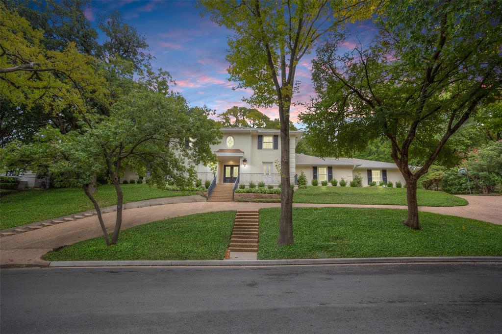 Fabulous opportunity in desirable, private Westover Hills. Located on a quiet cul de sac, this state home was recently renovated and updated, with interior design by Emily Gilbert. Beautiful kitchen with large island, ample built-ins, and gas range opens to a large family room with fireplace and wet bar. Gracious formal dining room with striking wallpaper, designer chandelier and butler's pantry. Study includes paneled walls and French doors to front patio. Spacious master suite with views of the pool and backyard features a vaulted ceiling, his and her closets, elegant bath with separate vanities, soaking tub and separate shower. Completing the downstairs are two additional living areas, guest bedroom with updated full bath and elegant powder room. Upstairs offers three bedrooms, two bathrooms, and playroom with built-ins. Jump into the heated pool year round with spa and waterfall, perfect your short game on the turf putting green, or relax by the fire pit in the backyard.