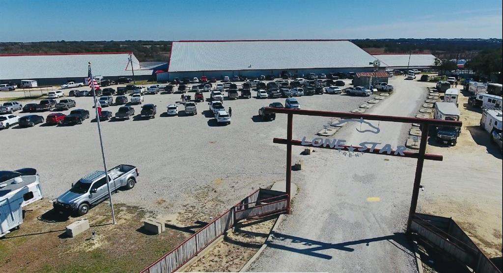 LONE STAR ARENA IN STEPHENVILLE, TX WITH 135.43 ACRES OF PRIME COMMERCIAL PROPERTY FOR SALE!! With this multi-purpose arena & event center, that offers roughly 150,000 sq ft under roof, and another 57,000 +- sq ft covered area, and 2 entrances, the POSSIBILITIES ARE ENDLESS!  Also known as Lone Star Arena, this commercial property is located in Stephenville, TX. Known for a City of Champions, Tarleton State University and is the home to many professional Cowboys and Cowgirls.  A prime, convenient business location with highway frontage and traffic in a fast-growing community.  The exceptional visibility from HWY 377 has allowed this commercial real estate to become a highly sought out event center (big & small) from all over the world! Seats close to 3,000 spectators. Some features include: 2 separate indoor arenas (under 1 roof), 7 renovated skyboxes, 110 RV hookups, 344 stalls, 8 big ass fans, plenty of parking, a Private Club and so much more! **ADDITIONAL OPTIONS TO PURCHASE - SEE LISTING AGENT