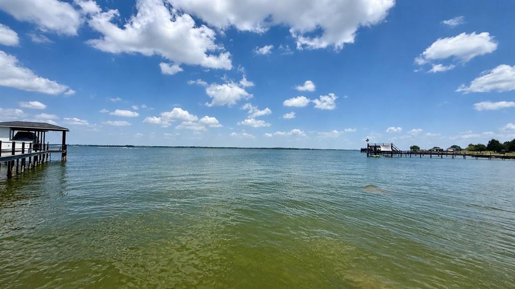 Wake each morning to the peaceful beauty of wide-open water, gentle breezes, and endless Texas skies from this exceptional 1-acre waterfront homesite in the gated Southpoint community on Richland Chambers Lake. Tucked away on a quiet cul-de-sac, this property offers a rare combination of privacy, panoramic open water views, and an impressive 245 feet of shoreline, creating the perfect setting to design a custom lakefront retreat where every window captures the beauty of the lake.

The shoreline is already enhanced with a durable steel retaining wall and convenient water steps, providing both protection and easy access for swimming, fishing, kayaking, or simply dipping your toes in the water. A handful of mature trees add character and natural shade without limiting your home's placement, allowing you to maximize both the spectacular views and outdoor living spaces. Whether you envision a sprawling single-story home with expansive patios or a multi-level design with elevated lake views, this property offers the ideal canvas to bring your vision to life.

Southpoint is one of Richland Chambers Lake's most desirable waterfront communities, offering residents gated entrance access, a private boat ramp and fishing pier, plus a community swimming pool with an outdoor picnic pavilion for gathering with family, friends, and neighbors. Protective deed restrictions preserve the beauty and value of the neighborhood with site-built homes only and minimum living area requirements ranging from 1,600 to 2,000 square feet depending on the home's design and number of levels.

If you've been searching for a place where peaceful mornings, unforgettable sunsets, and year-round lake living become part of everyday life, this extraordinary waterfront homesite is ready to become the foundation for your dream home on Richland Chambers Lake.