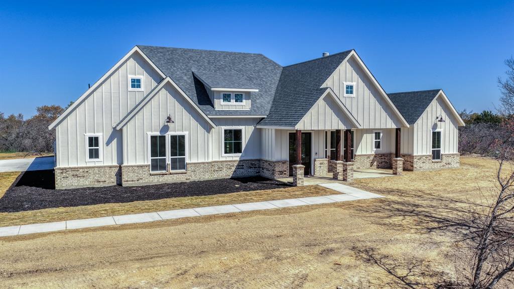 The proposed Rebekah Plan, where spectacular design meets charming character! Spanning 2,507 square feet, Inside, every detail speaks to comfort and versatility 4 spacious beds, 4 full baths, a convenient half bath, & 2 car garage but can add a 3rd car! 5 Ag Exempt acres!! The great room features a vaulted ceiling, cozy wood-burning fireplace, & stunning views of the rear porch. The dining room is open to the great room with seamless access to outdoor living, perfect for entertaining or family meals with a view. The heart of the home is the large kitchen island that seamlessly connects the kitchen to the living & dining areas, all drenched in natural light from ample windows. Custom painted cabinetry, stain grade available with quartz or granite countertops. Luxury vinyl plank floors in the common areas with carpet in the bedrooms & accent tile in baths & laundry. The owner’s suite offers a luxurious retreat with vaulted ceilings & an optional barndoor leading to the ensuite bath. The ensuite bath elevates relaxation with dual vanities featuring a makeup vanity too, a separate tub, & a spacious walk-in shower. Two more bedrooms each boast their own ensuite, ensuring privacy & comfort for family or guests. Outdoor Living at Its Best! This Chico plan is fully equipped with all the features one would expect from a custom home, including spacious porches, custom cabinetry & closets, Delta faucets, a concrete driveway, decorative mirrors, wall-mounted TV outlets, & hardline Ethernet ports. The builder has invested in high-quality details such as spray foam insulated walls & more. The two-car garage is thoughtfully designed with can lighting, a smart MyQ side-mount garage motor, & an auto-lock system for added security. The back porch is an entertainer’s paradise, with plenty of space to savor sunsets, share meals, or simply unwind. Images depicting a model home. Features & finishes are subject to change. Txt keyword ZHBHOME20 to 88000 for Virtual Tour & builder details.