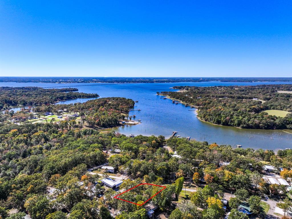 Welcome to White Oak Shores—the premier gated RV and Park Model community on world-famous Lake Fork! This fantastic opportunity includes four lots perfectly positioned on the northeast corner of Elm and Red Oak, just a block from the lake. The property features a carport with attached storage, a spacious outdoor deck ideal for entertaining, and endless possibilities for your RV port setup.

White Oak Shores offers amenities exclusively for property owners, including a private boat ramp and fishing pier with direct access to Lake Fork, a sparkling community pool, playground, and a clubhouse for gatherings and events. The community sewer system adds even more value and convenience (additional monthly cost).

With HOA fees at approximately $40 per month, you’ll enjoy full access to all these wonderful facilities at an affordable cost.

Whether you’re dreaming of a weekend getaway or a full-time lake lifestyle, you’ll fall in love with everything White Oak Shores has to offer. Don’t miss your chance to be part of this vibrant, welcoming community—there’s something for everyone here!