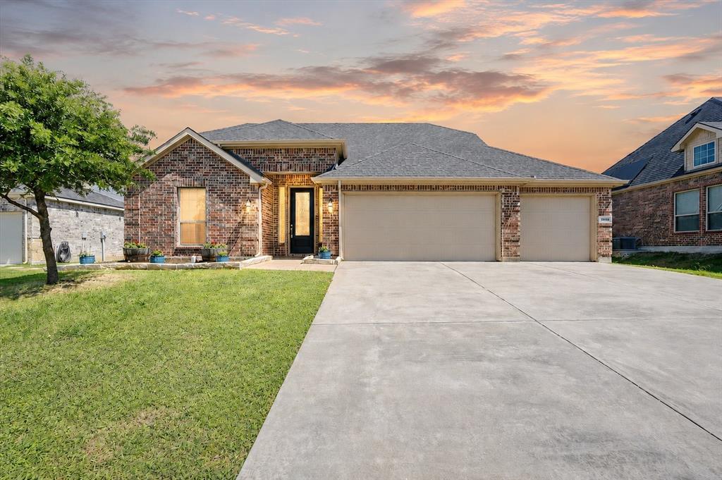 Tucked away on a quiet street in Oak Point near Lewisville Lake, this spacious one-story home offers the perfect blend of comfort, functionality, and outdoor space. Situated on an oversized lot with a large backyard with covered patio, there’s plenty of room to entertain, play, garden, or even add a future pool. Recently refreshed with brand new carpet, fresh interior paint, professionally cleaned tile flooring, and updated front landscaping, this home is truly move-in ready. Inside, the open-concept layout features vaulted ceilings, abundant natural light, and a cozy fireplace that flows seamlessly into the kitchen and dining areas. The kitchen offers granite countertops, a large island, generous cabinet storage, and stainless appliances designed for both everyday living and entertaining. Refrigerator, washer, and dryer all convey with the home, adding extra value and convenience for the next owner. The spacious primary suite features a large walk-in closet, dual vanities, soaking tub, and separate shower for a relaxing private retreat. The flexible 4-bedroom layout also offers the perfect option for a home office, workout room, or guest space. A RARE 3 CAR GARAGE adds valuable storage and convenience. Enjoy peaceful neighborhood living just minutes from Lewisville Lake, parks, shopping, and dining.