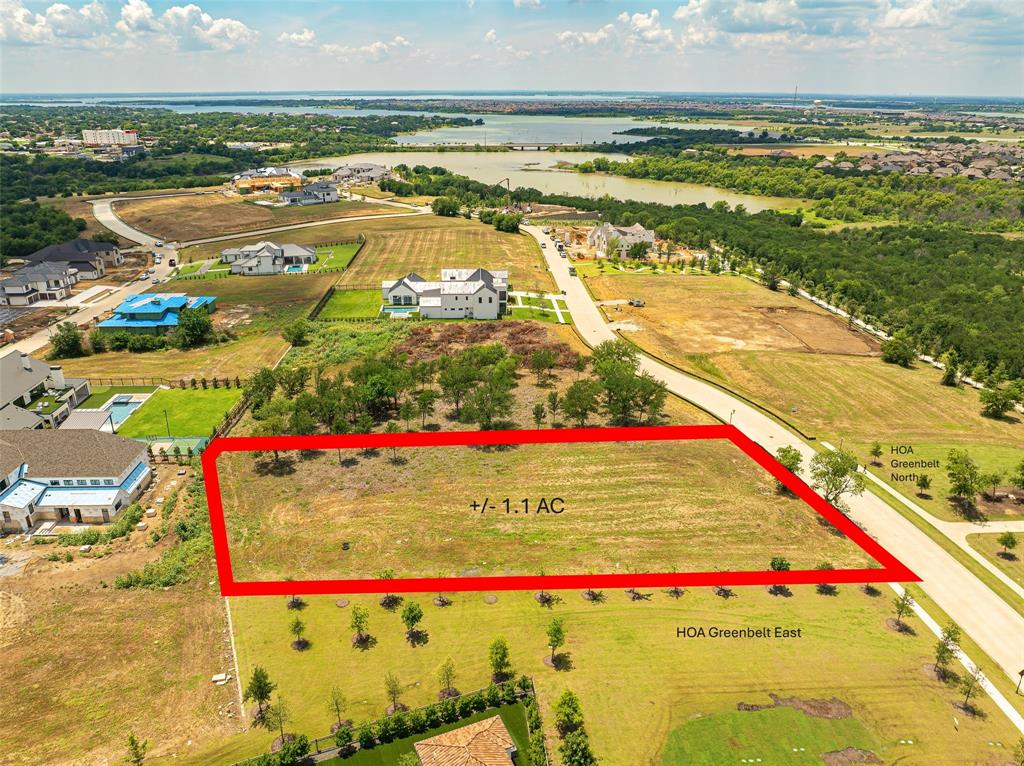 Exceptional opportunity to design a world-class custom estate on a rare 1.1-acre homesite within one of Frisco's most prestigious twenty-four seven guarded and gated enclaves. This prime corner lot is flat and ready for immediate construction, saving you in six-figures expenses by eliminating or minimizing the need for retaining walls and extensive dirt filling. Enjoy built-in privacy with HOA-maintained greenbelts to the east and north without the massive site-prep budget. These permanent buffers feature acres of natural beauty and an adjacent walking trail. Located just a short walk from Lake Lewisville, this community offers complete architectural freedom with no style limitations, seamlessly accommodating designs from timeless traditional to cutting-edge contemporary.  You have the option to select your own custom builder or partner with the premier luxury craftsmen currently active within the community to execute your unique vision.  Perfectly suited for executives and professionals, the estate is less than 5 miles from major corporate headquarters with swift access to the Dallas North Tollway and Highway 121. Enjoy the ultimate North Texas lifestyle just minutes from elite sports and entertainment destinations, including The Star, the world headquarters of the Dallas Cowboys, the newly established headquarter of the PGA of America, and the premier Universal Kids Resort, bringing world-class theme park entertainment to Frisco..  This property represents a rare opportunity to design a legacy home where luxury meets convenience. Secure your piece of Frisco’s finest real estate and build an estate that reflects your vision and lifestyle!
