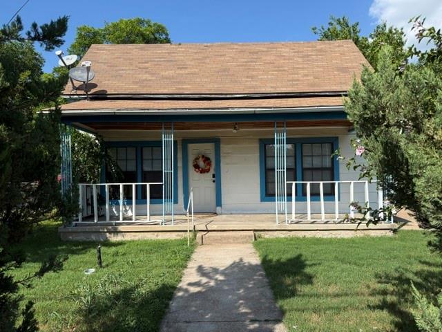 INVESTORS! FIXER-UPERS! This adorable little cottage located on a large lot with alley access behind it needs a little TLC but would provide excellent rental in years to come.  Renters just moved out so it is a go and show.  A little floor work in the dining room and kitchen required, a little roof attention in one area, and it's move in ready.  Great location, beautiful trees and privacy in back, and a GREAT starter home for those who want to put some elbow into it.