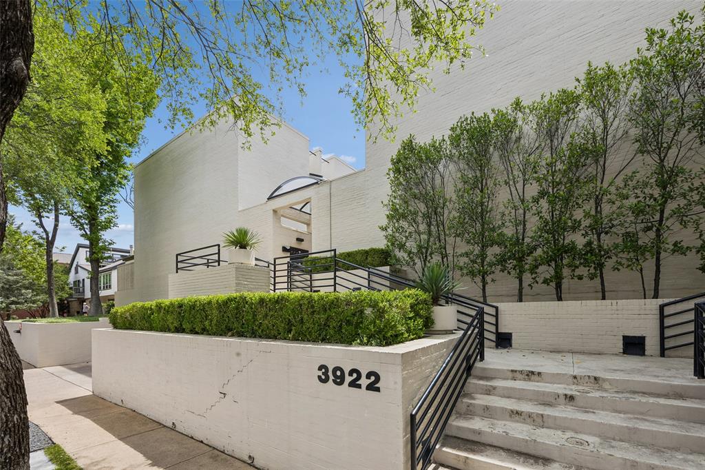 Charming and beautifully updated, this condo spans 1,033 square feet of bright, inviting living space in an unbeatable Dallas location. Designed with both relaxation and entertaining in mind, the residence features three distinct private outdoor areas, including two seamlessly turfed patios perfect for pets, morning coffee, or hosting friends. Inside, the expansive main living area is flooded with natural light from a wall of windows and features a cozy gas-starter fireplace as its focal point. Sliding glass doors lead directly to the main turfed outdoor space, creating an effortless indoor-outdoor flow. The generous dining area easily accommodates dinner parties and connects to a second private patio optimized for grilling. Perfectly central to the layout is a spacious galley kitchen equipped with abundant cabinetry, making meal prep and hosting a breeze. Upstairs houses both bedrooms for maximum privacy. The primary suite serves as a peaceful retreat complete with a large walk-in closet. The secondary bedroom offers great flexibility as a guest space or home office and overlooks the third private balcony. The upstairs hallway bathroom is beautifully illuminated by a large skylight and features dual sinks alongside a spacious shower and tub combination. Adding to the property's convenience and security are two dedicated, covered parking spaces nestled within a secure, gated area. Situated just steps from the vibrant West Village and Katy Trail entrance, residents will enjoy a dynamic, walkable lifestyle packed with laid-back retail shops, trendy boutiques, and exceptional dining. You are also just minutes away from the energy of Knox-Henderson, celebrated for its hottest eateries and cocktail bars, as well as the Dallas Design District, known for its upscale art galleries, high-end showrooms, and acclaimed culinary experiences. This condo offers the perfect blend of comfort, style, and urban convenience.
