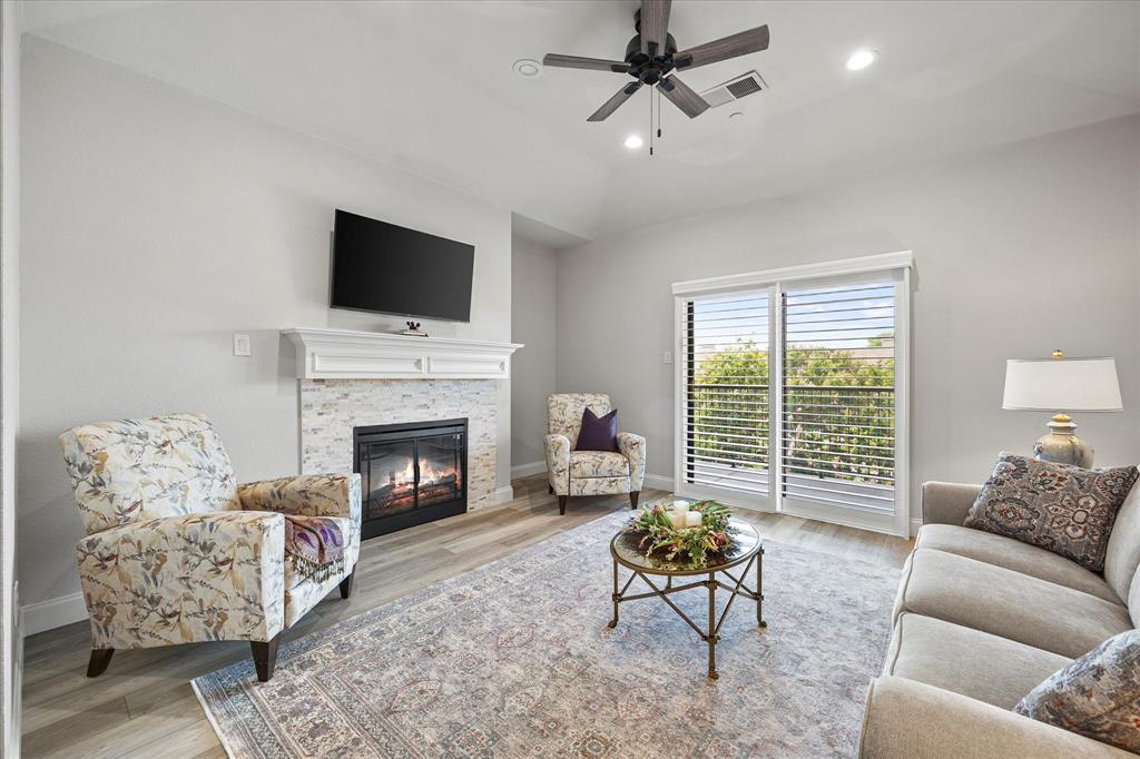 PRICE IMPROVEMENT plus HOA DUES have been paid up to May 2026! Welcome to this beautiful condo offering views of Lake Ray Hubbard and an impressive list of upgrades throughout. From the moment you arrive, you’ll notice the attention to detail and thoughtful improvements that make this condo a truly special place to call home! Enjoy fresh interior paint, luxury vinyl plank flooring, new front door with heavy duty storm door  and plantation shutters on every window—including the sliding balcony door. The inviting living space features an updated electric fireplace with a tiled border, creating a cozy atmosphere with a modern edge. The kitchen has been upgraded with countertops, backsplash, sink, faucet, and garbage disposal, along with an electric range and microwave. Updated cabinet hardware and recessed lighting added throughout the home add a clean, contemporary touch.The primary bath has been completely transformed, featuring a walk-in glass-door shower with modern fixtures and bench, a soaking tub, a sleek double-sink vanity with countertops, elegant light fixtures and crystal cabinet pulls.  The guest bathroom has also been tastefully renovated with tub, glass sliding door, fixtures, updated vanity with countertop and sink, and a toilet.  Hot water heater and HVAC unit replaced . Extra blown in insulation in attic. Exterior stairlift added in 2024.   Two assigned carport parking spaces. Located adjacent to one of the community pools and just steps from the serene shores of Lake Ray Hubbard and within walking distance to the Harbor, this condo is low-maintenance lake living at its finest, with no detail overlooked. Don’t miss your opportunity to own this stunning, move-in-ready gem with lake and pool views!