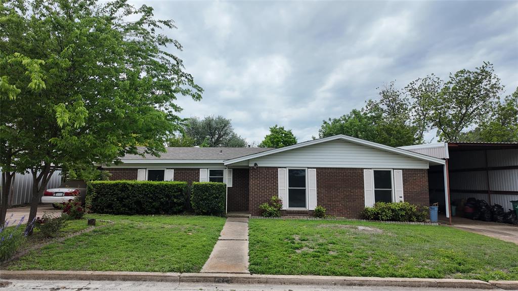 This well-maintained 1970 brick home offers comfortable living with great outdoor amenities. Featuring 3 bedrooms and 1.5 baths, this property includes an open-concept dining, kitchen, and living room are perfect for everyday living and entertaining. A convenient utility room and bar seating area add to the home’s functionality. The home is equipped with central heat and air and gas service for efficient comfort year-round.
Outside, you'll find excellent improvements including an RV carport, two-car carport, and a 20' x 20' shop-storage building, ideal for hobbies, projects, or extra storage. A greenhouse provides space for gardening enthusiasts.The yard is beautifully accented with mature landscaping, including crepe myrtles, red bud, Texas ash tree, Lady Banks rose bush, and fire bush. Irises bloom in both the front and back yards, and holly shrubs line the front windows, adding classic curb appeal. A solid home with great extras, beautiful yard, and plenty of space inside and out.