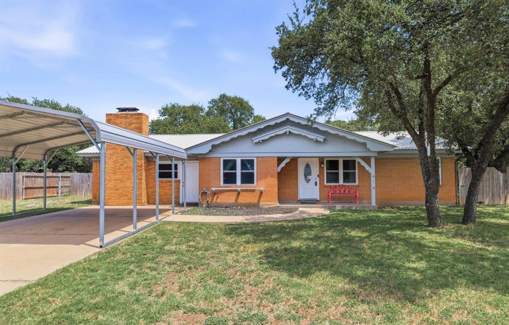 Fantastic opportunity with 2697 sq. ft. of total living space! The updated main home consists of four bedrooms, two bathrooms with an additional detached one bedroom, one bath guest house with its own driveway and separate street entrance. This is a perfect opportunity for an Airbnb, rental income or multigenerational living. The main home features an updated kitchen with stainless steel appliances, double oven and the SS refrigerator conveys. The primary bedroom has a wall-to-wall beautiful stone fireplace, en-suite bath and is currently being used for a second living area. The backyard is tree lined with a concrete walkway to the 1076 sq. ft guest house. The guest house has a kitchenette, two living areas (one could be used as a second bedroom), a full bathroom and a bedroom with large walk-in closet. There is a nice metal 14x10 storage building that will convey. Two car carport, oversized corner lot, newer windows and sought after Woodland Heights Addition. Call today to schedule your viewing!