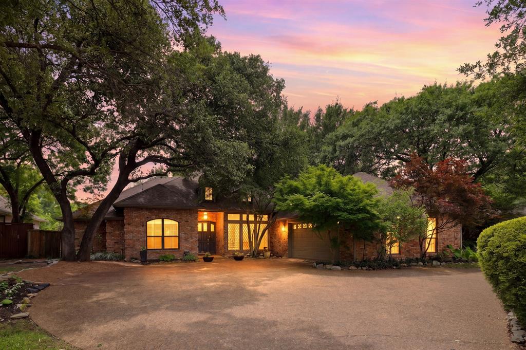 Gorgeous Merriman Park home in a rare and stunning setting! Situated on a 79 x 129 greenbelt lot, this beautiful home has it all. It is on a private and vibrant street and is surrounded by mature trees. It features 4 bedrooms, 3 bathrooms, 2 living areas, a pool and a dream backyard. Gleaming hardwoods are throughout this open and perfect layout. One living area has high ceilings, a wood-burning fireplace with a gas starter and looks over the backyard and lush greenbelt space. The other living area is cozy with vaulted ceilings and a wet bar that has a sink and refrigerator. The open kitchen has custom cabinets, granite counters and GE Monogram appliances that include a commercial range and built-in refrigerator. The primary suite overlooks the backyard and covered patio and features 2 separate bathroom areas that each have their own sink, toilet and walk-in closet. Those bathrooms share a shower. The split floorplan has 2 other bedrooms in one area and the 4th bedroom on the other side of the home. The backyard has a covered patio, a pool and spa and it overlooks a lush and serene greenbelt. It's hard to find a setting like this, so come quickly. It's ready for living and summer fun!