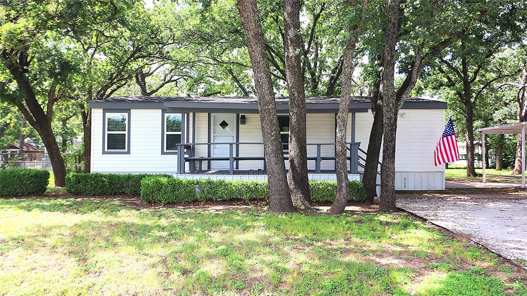 Cozy Home on country lot – Just refreshed & Move-In Ready! Must Sell! All offers considered. 3 bed 2 bath mobile home on 0.31 acre lot. Buyer agents welcome. All financing options accepted by Seller. This house also qualifies for special bank financing with zero down. Owner will Carry with reasonable down as well (owner doesn’t care about cre dit). If interested come drive by the house. There’s a sign in front of the house with my cell (Seller or Listing Agent) on it. Call me and I’ll get you inside to see it.  This move-in-ready 3-bedroom, 2-bathroom mobile home sits on a tree-shaded 0.31-acre lot in a quiet, secluded neighborhood with almost no traffic. Inside, you'll find fresh paint and new flooring in the living area, giving the whole home a clean, bright, and updated feel that's ready for you to settle right in. Outside, heavy mature trees provides shade and privacy. Big deck is perfect for grilling, relaxing, or hosting friends, plus a wide driveway with plenty of room for guests, trucks, or weekend toys. Covered parking keeps your vehicles protected year-round. With no HOA, you get all the space, freedom, and fresh air you could want move in without lifting a finger. Morning coffee under the trees hits different out here. Located just minutes from Burleson shopping, dining, and schools, this property gives you space and privacy without sacrificing convenience. If interested, drive by and call me. Priced to sell — don't wait.