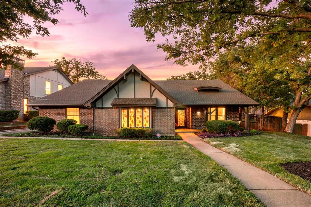 Designed for the way you truly live, this beautifully updated 4-bedroom, 2.5-bath home offers the perfect blend of comfort, flexibility, and convenience. The inviting main living area serves as the heart of the home, featuring a cozy fireplace framed by custom built-in cabinetry for both style and storage. The updated kitchen is thoughtfully designed with custom cabinetry, quartz countertops, an eat-in breakfast bar, new range, and a spacious breakfast room filled with natural light from oversized windows overlooking the backyard. Whether enjoying a quiet morning coffee or hosting weekend gatherings, this space feels warm and welcoming. The relaxing primary suite offers a sitting area, and ensuite with two private prep areas and vanities, along with fine finishes found in much more expensive homes, including Carrera marble, granite, an updated deep soaker tub and luxurious shower - all designed for unwinding after a long day. Updates don't end there, but can be found in each bathroom, as well as a neutral palette throughout the home,  With four generously sized bedrooms, and a versatile floor plan that provides a flex space perfect for a second living area, formal dining room, playroom, or home office, there’s room for guests, work-from-home needs, or multi-generational living. Step outside to a large patio ideal for outdoor dining, grilling, and entertaining, while the rear-entry garage adds both privacy and curb appeal. The Texas sized garage offers plenty of room for large cars, workbenches, outdoor tools and much more! Ideally located within walking distance to the local elementary school and conveniently situated between Dallas and Fort Worth, this home places you minutes from Texas Live!, AT&T Stadium, Globe Life Field, Six Flags, and Texas Rangers Golf Club. Enjoy quick access to dining, entertainment, and year-round attractions while still coming home to your own private retreat.  See it TODAY or see it SOLD!