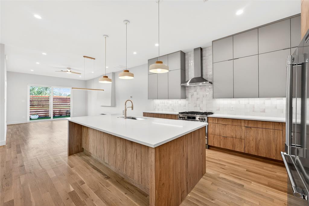 *$7,500 IN SELLER PAID CLOSING COSTS* Welcome to this beautifully designed, newly constructed modern single-family attached home offering a perfect blend of contemporary luxury, thoughtful functionality, and an unbeatable location. Situated near Inwood and Lovers Lane, and just minutes from premier restaurants, shopping, and the the Tollway, this 3-bedroom, 2.5-bath residence puts you in the heart of convenience and style.
From the moment you step inside, you’ll notice the attention to detail and high-end finishes that define this home. Beautiful white oak flooring flows seamlessly throughout along with solid core eight foot doors, adding warmth and sophistication to the clean, modern aesthetic.  Level 4 finish walls ready to showcase your art work and a water vapor fireplace to be enjoyed year round.  
The open-concept kitchen is an entertainer's dream, featuring custom European-style cabinetry to the ceiling, sleek quartz countertops, and premium stainless steel appliances—including a microwave drawer, refrigerator, gas stove and a wine refrigerator. A built-in trash pullout system and thoughtfully integrated storage on the back side of island elevate both form and function.
All bathrooms exude modern elegance with floating vanities, designer tile, and contemporary wall-mounted commodes, creating a spa-like experience.
Upstairs, the spacious bedrooms are light-filled and offer ample storage including a built in desk with additional storage space. The primary suite is a private retreat with a beautifully appointed en-suite bath with wet room and free standing tub, generous closet space, and motion activated under vanity lighting.

A serene courtyard offers additional all year green space with landscape turf surrounded by tigerwood panels and a gate equipped with finger print scan and code lock for added security.

Additional highlights include energy-efficient systems, clean architectural lines, and a layout ideal for both entertaining and everyday living.